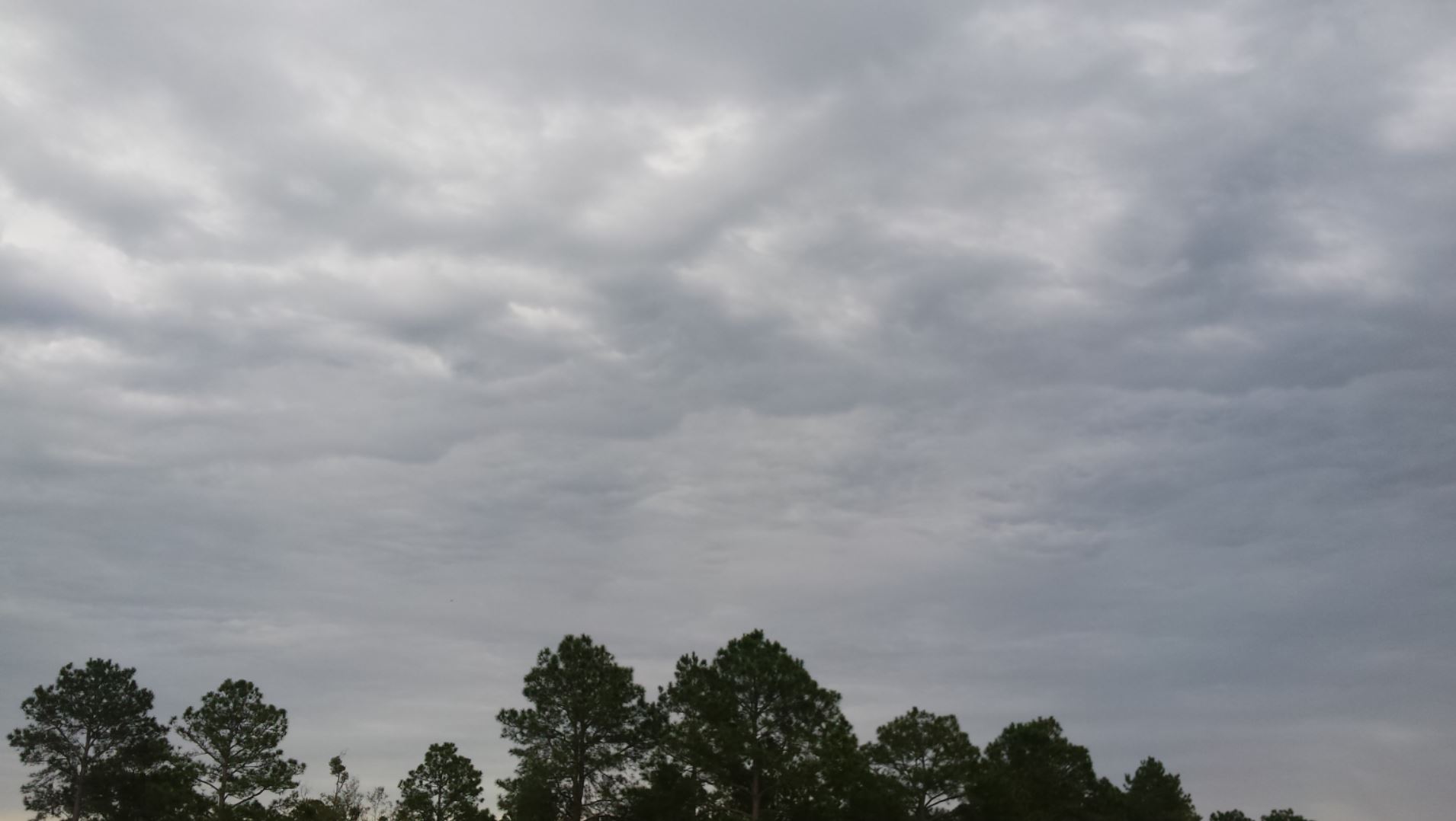 Overcast gray clouds as a smoke screen separating earth from the glorious heavens.